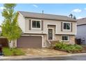 Charming two-story home with a brick facade and a well-maintained front yard in a suburban neighborhood at 3312 Meadow Ave, Broomfield, CO 80020