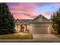 Beautiful single-Gathering home with warm exterior colors, a well-maintained lawn, and a two-car garage at 5322 Shetland Ct, Highlands Ranch, CO 80130