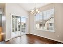 Dining room features hardwood floors and sliding glass doors to a covered patio at 11932 W Long Cir # 201, Littleton, CO 80127