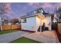 Backyard featuring a patio, stairs to an upper balcony, and a fenced-in yard at 2767 W 38Th Ave, Denver, CO 80211