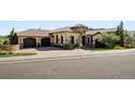 Beautiful home with a tile roof, stone accents, and a circular driveway at 7188 Raphael Ln, Littleton, CO 80125