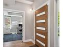 Entryway featuring a modern front door and a view into a bright office space at 2508 S Pennsylvania St, Denver, CO 80210