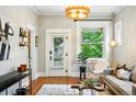 Bright living room with hardwood floors, large window, stylish furnishings, and modern lighting at 416 W 3Rd Ave, Denver, CO 80223