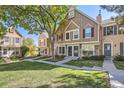 Charming townhome exterior with landscaping and walkway at 1342 S Idalia St, Aurora, CO 80017