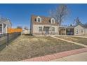 Charming home featuring stone accents and a covered carport for convenient parking at 1805 W Stoll Pl, Denver, CO 80221