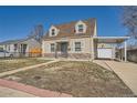 Charming home featuring stone accents and a covered carport with garage at 1805 W Stoll Pl, Denver, CO 80221