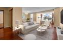 Modern living room with a large window, hardwood floors, and elegant decor at 2 Adams St # 1507, Denver, CO 80206