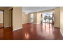 Bright living room featuring hardwood floors, a chandelier, and sliding mirror door closet at 2 Adams St # 1507, Denver, CO 80206