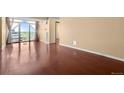 Spacious living room featuring hardwood floors, large window, and great natural light at 2 Adams St # 1507, Denver, CO 80206