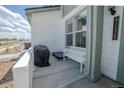 Welcoming porch with bench and cover, a perfect spot to enjoy the outdoors at 9152 Gladiola Way # E, Arvada, CO 80005