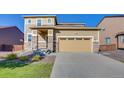 Charming home featuring stone accents on the front porch and a two-car garage at 9373 Pitkin St, Commerce City, CO 80022