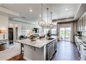 Beautiful kitchen island with granite countertops, pendant lights and stainless steel dishwasher at 16578 E 111Th Pl, Commerce City, CO 80022