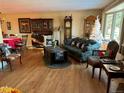 Living room with hardwood floors, fireplace, and comfy furniture at 7759 Lee St, Arvada, CO 80005