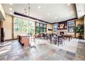Beautiful club house with fireplace, billiard table, island, and plenty of seating, perfect for entertaining at 13456 Via Varra # 406, Broomfield, CO 80020