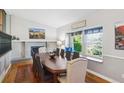 Charming dining area featuring a window seat, fireplace, and an elegant dining table for a cozy, inviting atmosphere at 6537 S Brentwood Way, Littleton, CO 80123