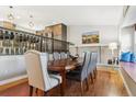 Dining room with hardwood floors, fireplace and elegant furnishings for refined meals and gatherings at 6537 S Brentwood Way, Littleton, CO 80123