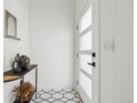 Bright foyer featuring stylish black and white tiling and contemporary decor at 3363 W 32Nd Ave, Denver, CO 80211