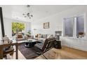 Elegant living room boasts ample natural light and contemporary furnishings for comfortable living at 3363 W 32Nd Ave, Denver, CO 80211
