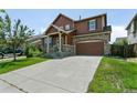 A beautiful shot of a two-story home from the driveway on a sunny day at 9919 Memphis St, Commerce City, CO 80022