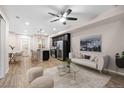 Open-concept living area featuring modern furnishings and stainless steel appliances at 23630 E 5Th Pl, Aurora, CO 80018