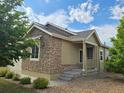 Beautiful home with stone accents, manicured landscaping, and a welcoming front porch at 483 W 172Nd Pl, Broomfield, CO 80023