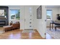 Light and airy entryway with a modern front door at 5601 E Iowa Ave, Denver, CO 80224