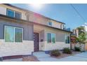 Modern two-story home with stone and siding exterior at 5601 E Iowa Ave, Denver, CO 80224