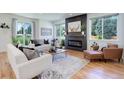Spacious living room with hardwood floors and fireplace at 5601 E Iowa Ave, Denver, CO 80224