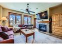 Comfortable living room with a fireplace, and large windows at 505 S Main St # 1313, Breckenridge, CO 80424