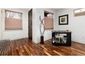 Modern living space featuring hardwood floors, bar cart, and natural light at 2334 Lowell Blvd, Denver, CO 80211