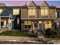 Charming townhouse exterior with unique architectural details and well-maintained landscaping at 1247 S Idalia St, Aurora, CO 80017
