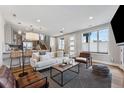 Inviting open-concept living space with hardwood floors and plenty of natural light at 1259 Perry St, Denver, CO 80204
