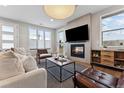 Comfortable living room showcasing fireplace, modern furniture, and warm lighting at 1259 Perry St, Denver, CO 80204