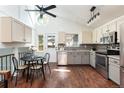 Stylish kitchen with stainless steel appliances, bright lighting and breakfast table with chairs at 11381 Jay St, Westminster, CO 80020
