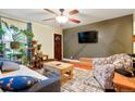 Cozy living room with modern decor, plants, and ample seating space at 4210 S Fox St, Englewood, CO 80110