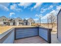 Relaxing back deck offers a private outdoor space with views of the surrounding landscape at 8911 W Yale Ave, Lakewood, CO 80227