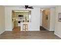 Updated kitchen with white appliances and light green cabinets at 13890 E Marina Dr # 612, Aurora, CO 80014