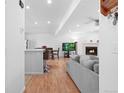 Bright, open floor plan with fireplace and kitchen view at 23 S Nome St # A, Aurora, CO 80012