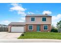 Charming two-story home with attached two-car garage and well-maintained lawn at 1206 Baldwin Park Cir, Castle Rock, CO 80104
