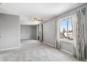 Serene main bedroom with plush carpeting, ample natural light, and neutral decor at 1206 Baldwin Park Cir, Castle Rock, CO 80104