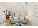 Spacious living room with high ceilings, staircase and modern furnishings at 2910 S Racine St, Aurora, CO 80014
