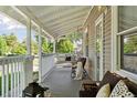 Inviting front porch with comfortable seating, creating a relaxing outdoor space for leisure and enjoyment at 3976 S Washington St, Englewood, CO 80113