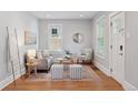 Bright living room with natural light, stylish furniture, and hardwood floors at 3976 S Washington St, Englewood, CO 80113