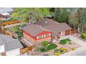 Aerial view of a brick home, showcasing its landscaped yard and neighborhood setting at 6919 S Valentia St, Centennial, CO 80112