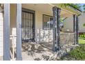 Inviting front porch featuring gray painted posts and a secure, decorative security door at 1145 S Boston St, Denver, CO 80247