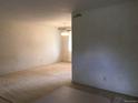 Spacious living room with ample natural light and a seamless flow to the dining area at 6411 W 82Nd Dr, Arvada, CO 80003