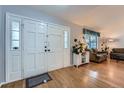 Spacious entryway with wood floors and natural light flowing into the living area at 5255 S Waco St, Centennial, CO 80015