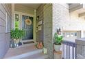 Inviting front entrance with a wreath, plants, and a welcome mat at 14307 Waterside Ln, Broomfield, CO 80023