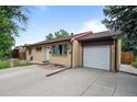 Inviting single-Gathering home with attached garage and a wide driveway at 1470 S Yates St, Denver, CO 80219