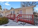 House exterior showcasing a red front porch and walkway at 5648 E Greenwood Pl, Denver, CO 80222